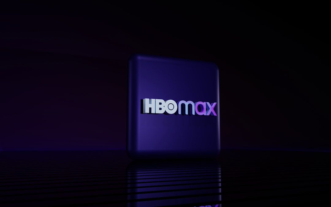Hbo max logo on a dark reflective surface.